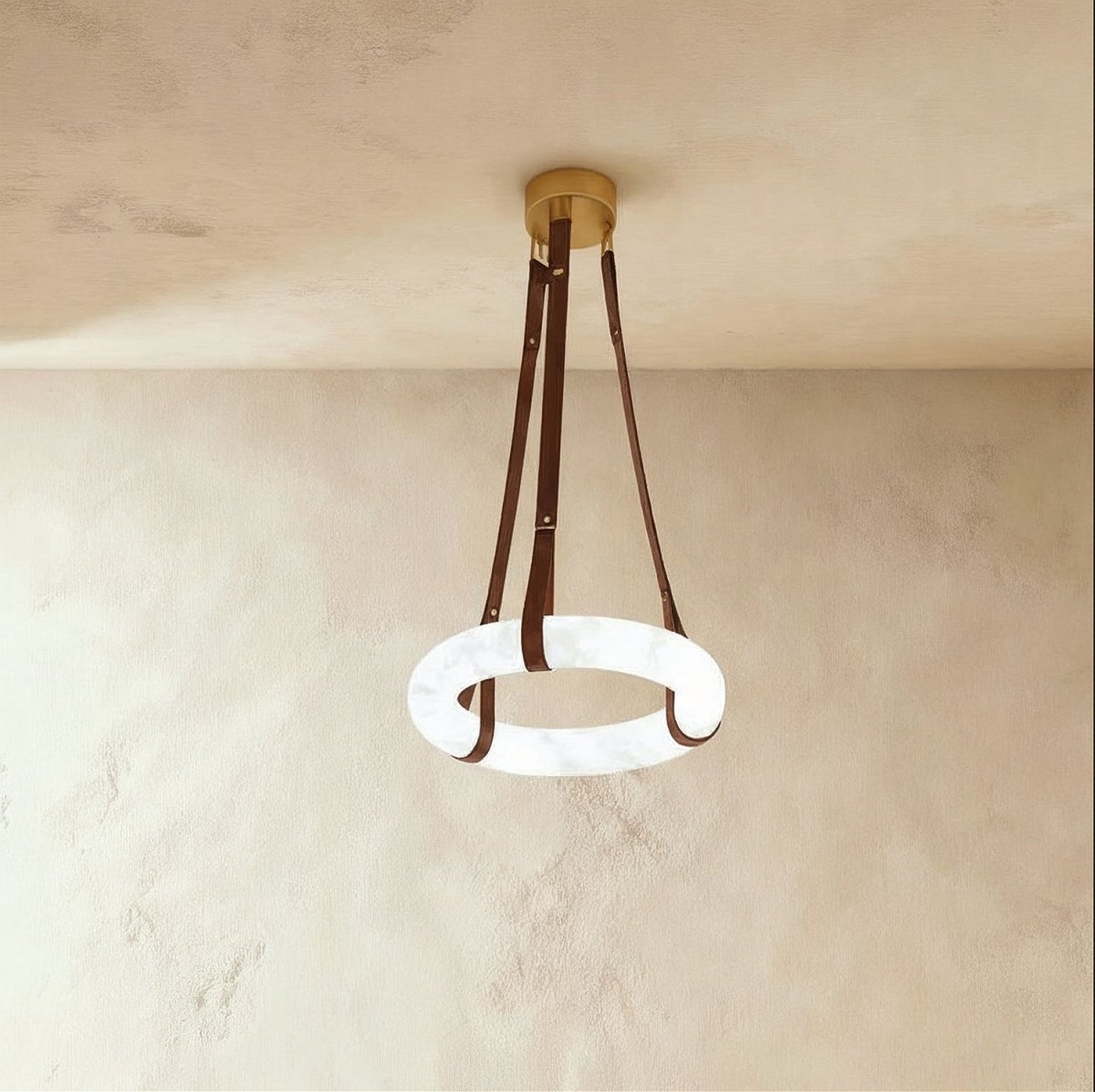 Aktis Alabaster Pendant Light, second lit and hanging in a styled room