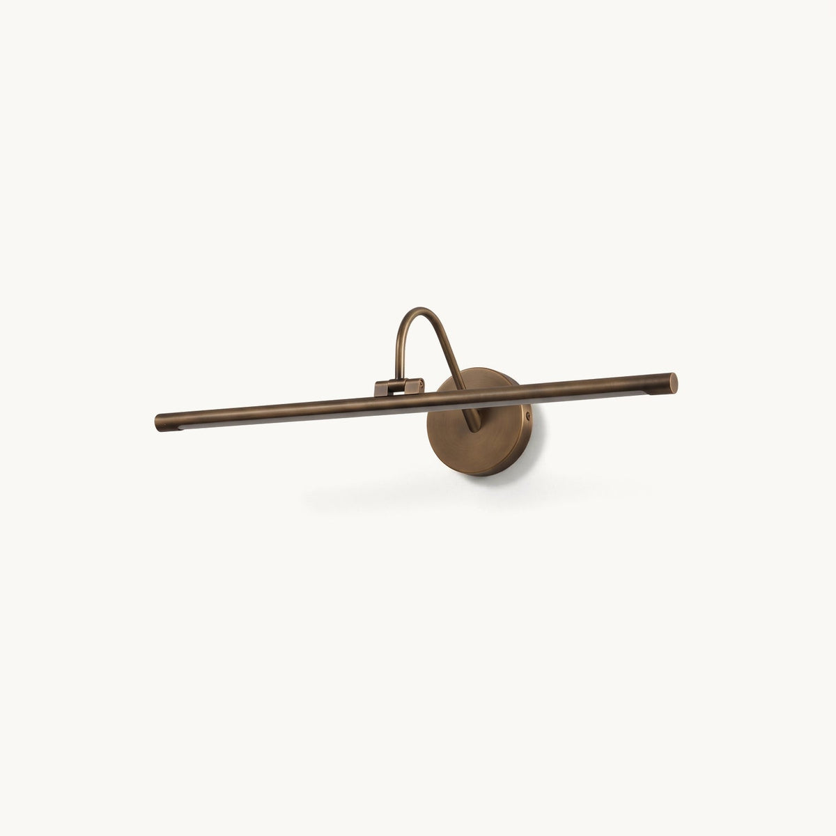 Averton Linear Brass Wall Sconce, lit in a styled room
