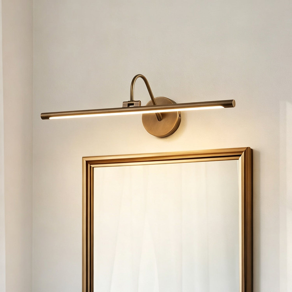 Averton Linear Brass Wall Sconce, held for scale