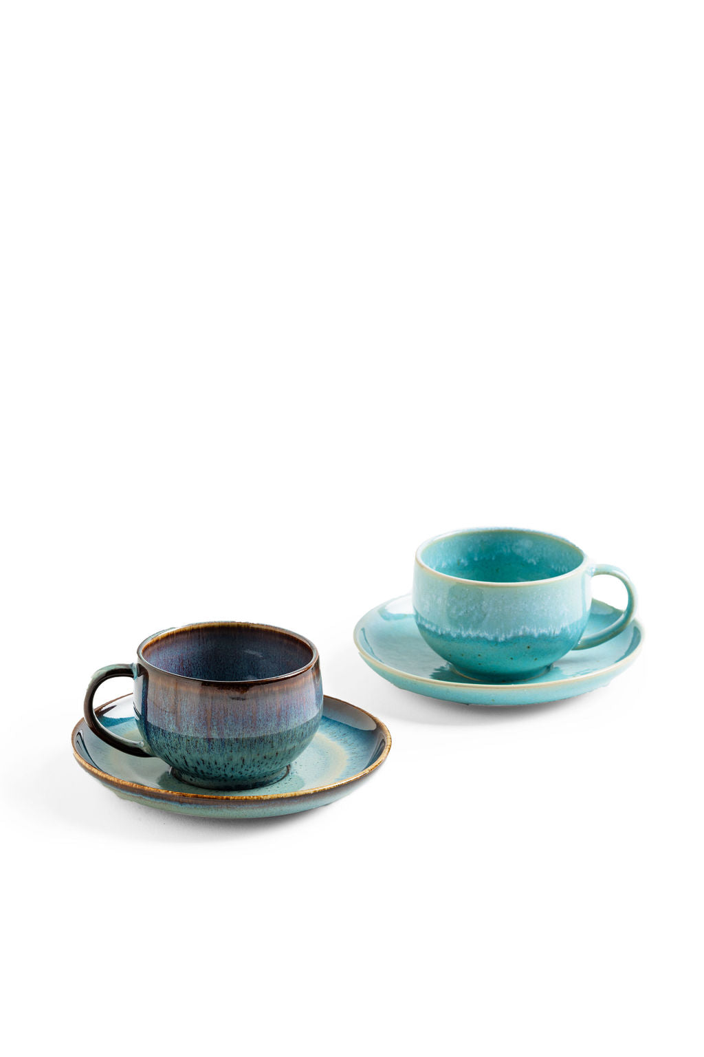 Cappuccino Mug & Saucer, held in hand for scale