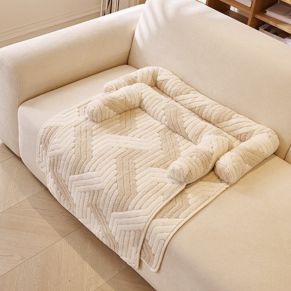 Chevron Plush Bolster Pet Sofa Bed, with a pet resting on it