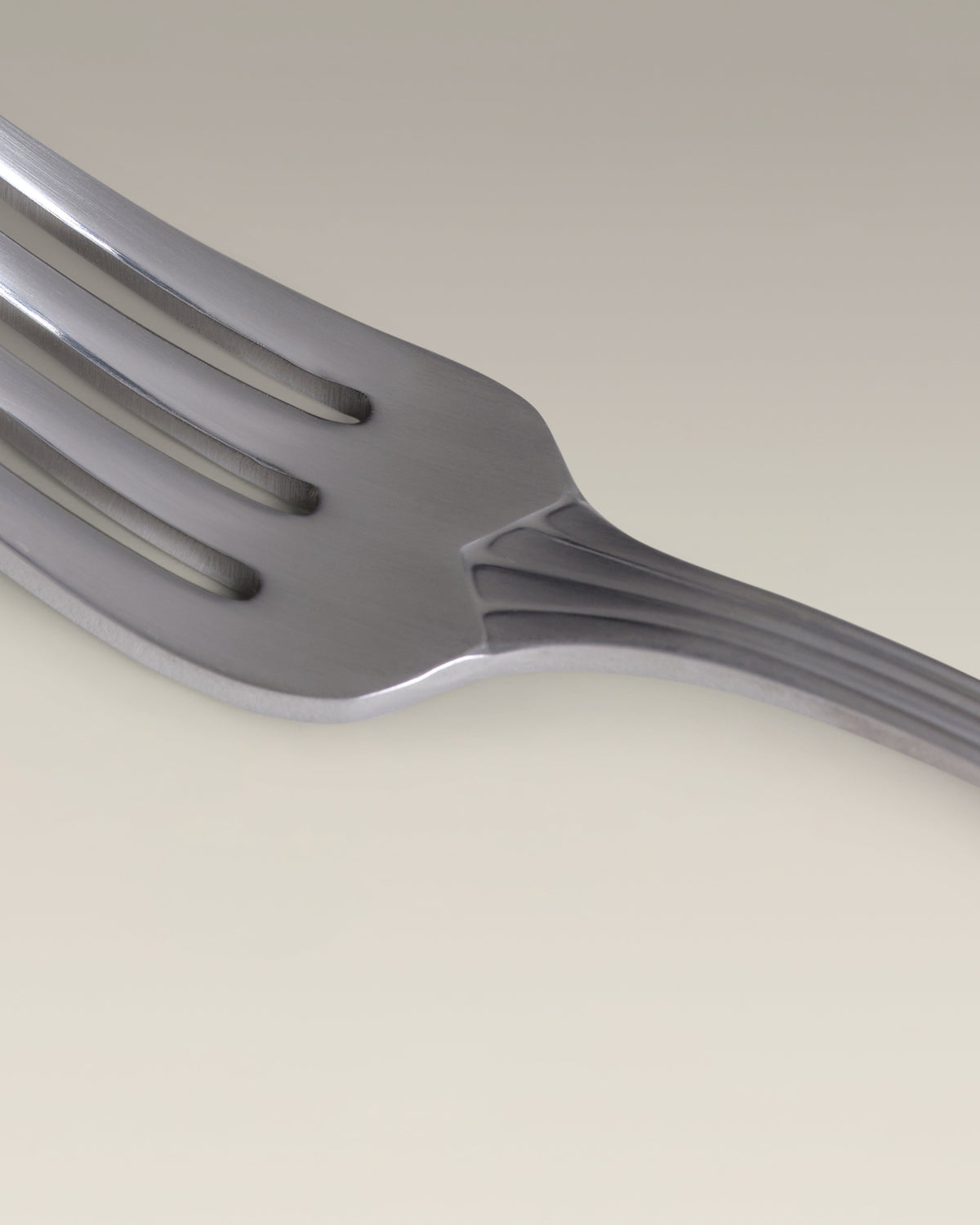 Crescent Four-Person Settings Flatware Set, second held in hand for scale