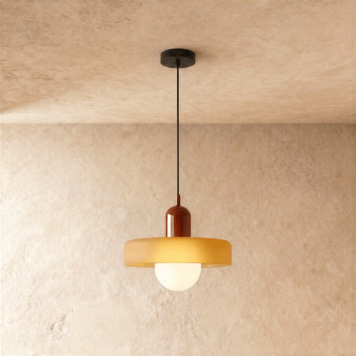 Cride Metal Pendant Light, second lit and hanging in a styled room