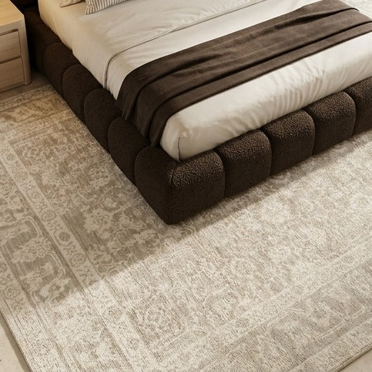 Heirloom Traditional Rug, styled on a sofa