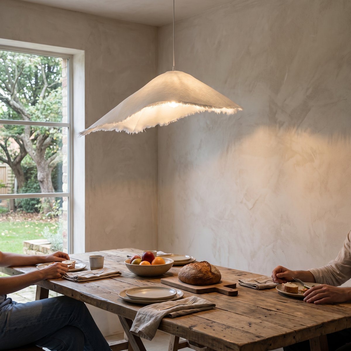 Jairo Metal Pendant Light, lit and hanging in a styled room