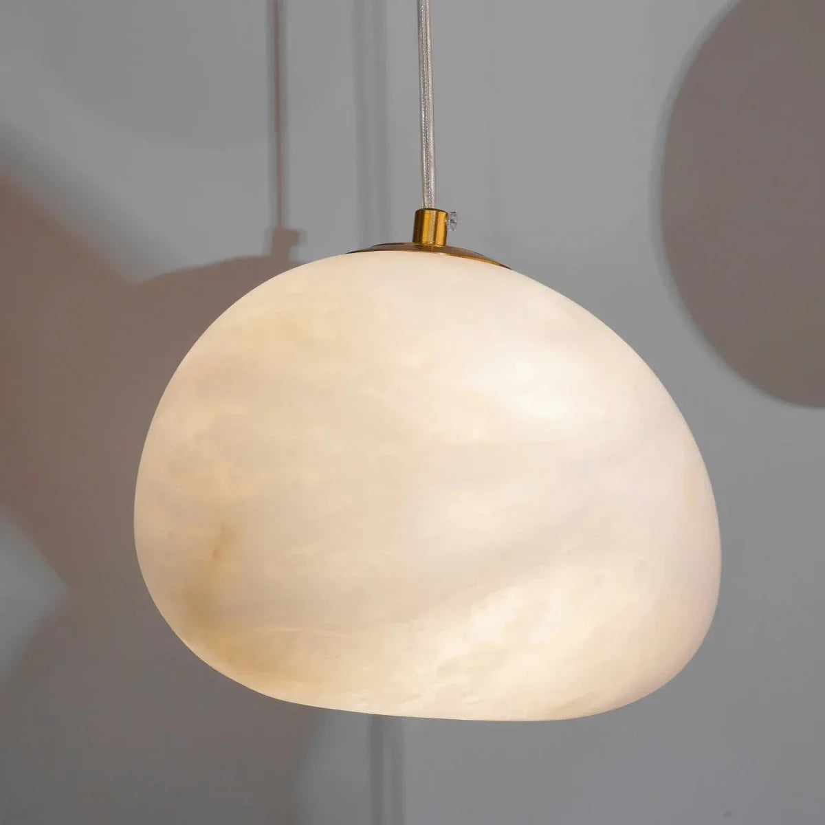 Lapis Alabaster Pendant Light, shown in scale within a hallway
