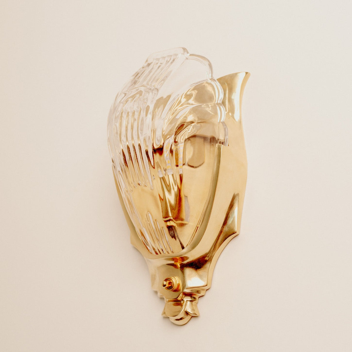 Lilith Brass Antique Art Deco Wall Light, lit after dark