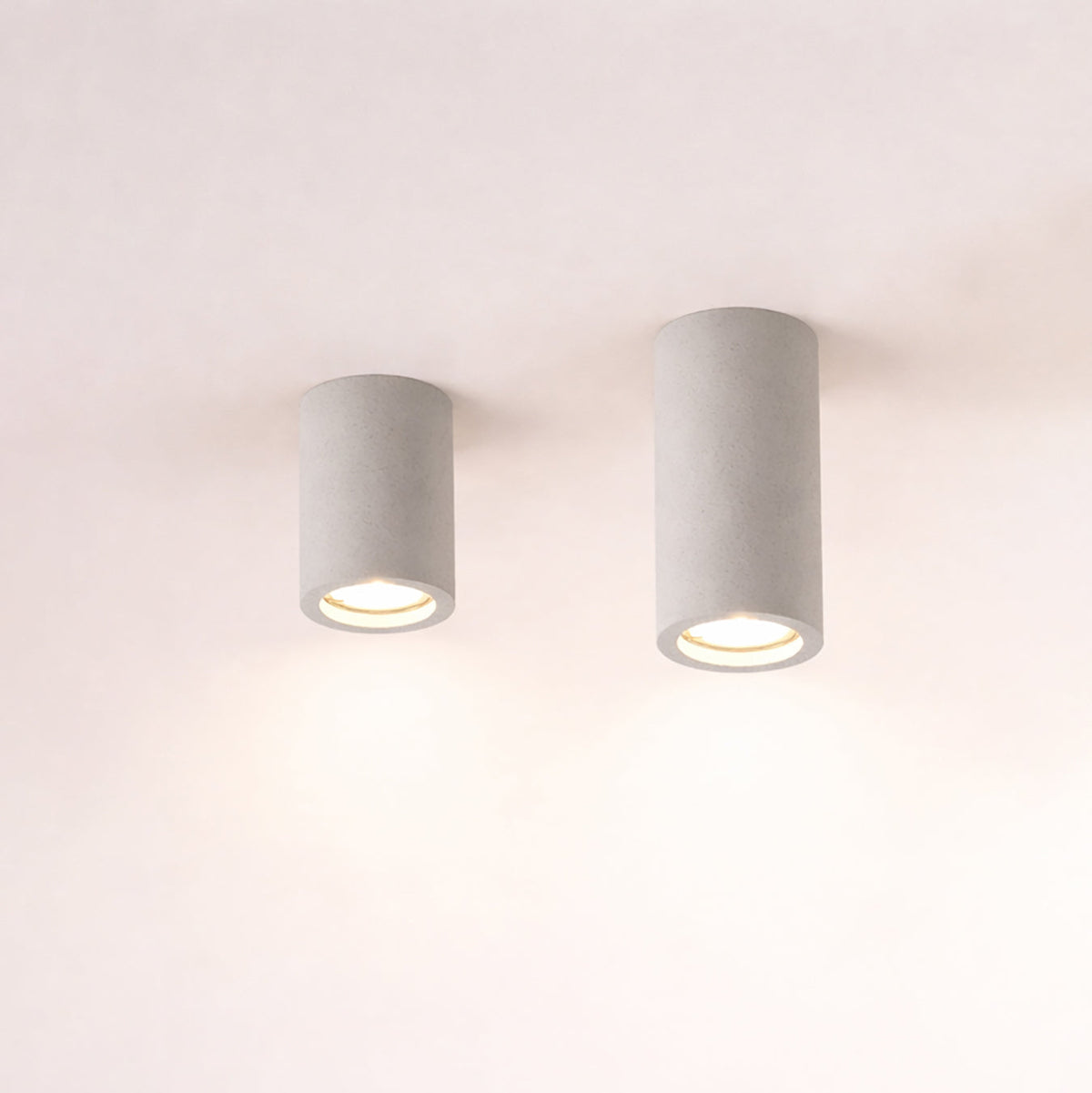 Lithos Minimalist Concrete Ceiling Light, fixture lit in a room
