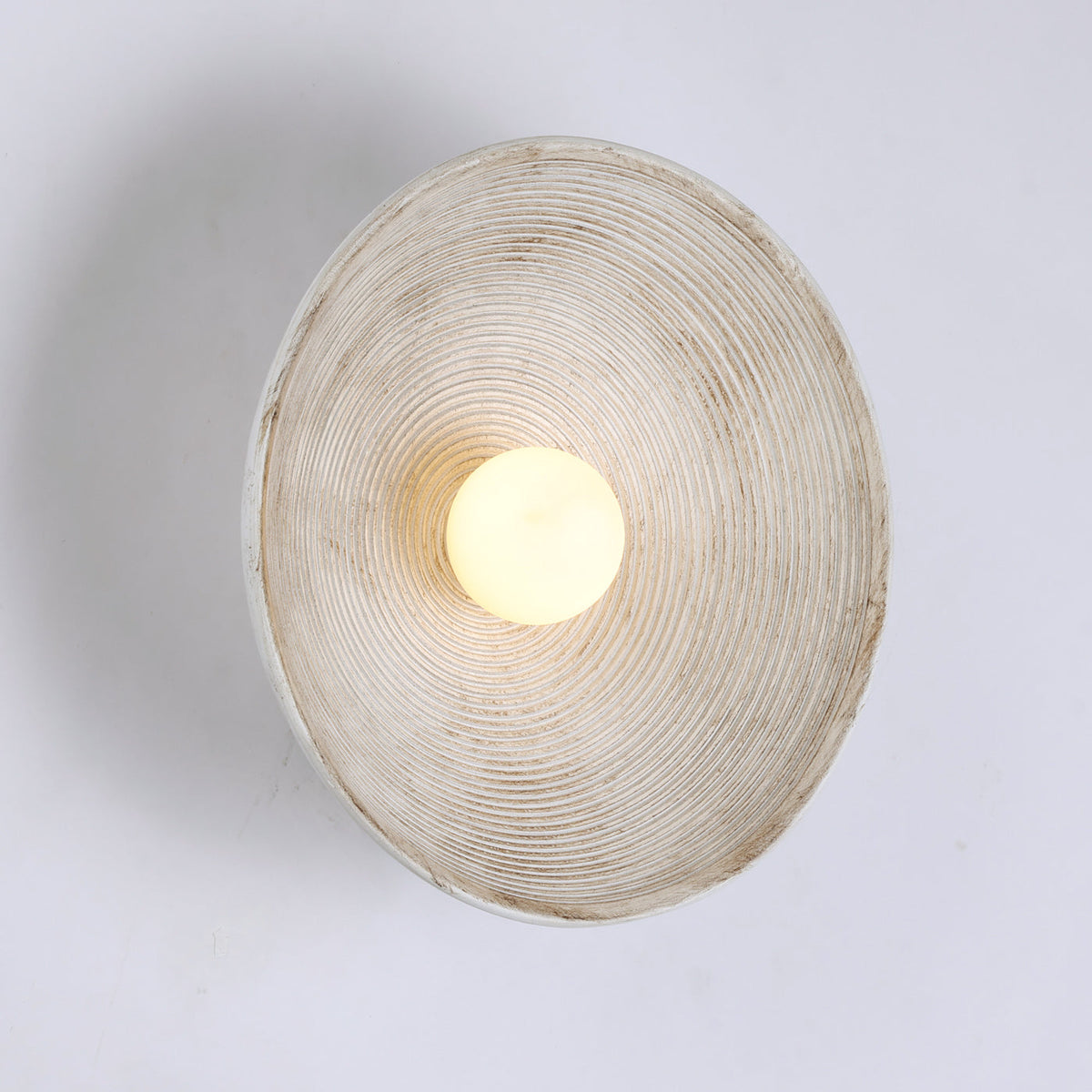 Longleaf Wooden Texture Plate Wall Light In White, scale beside a doorway