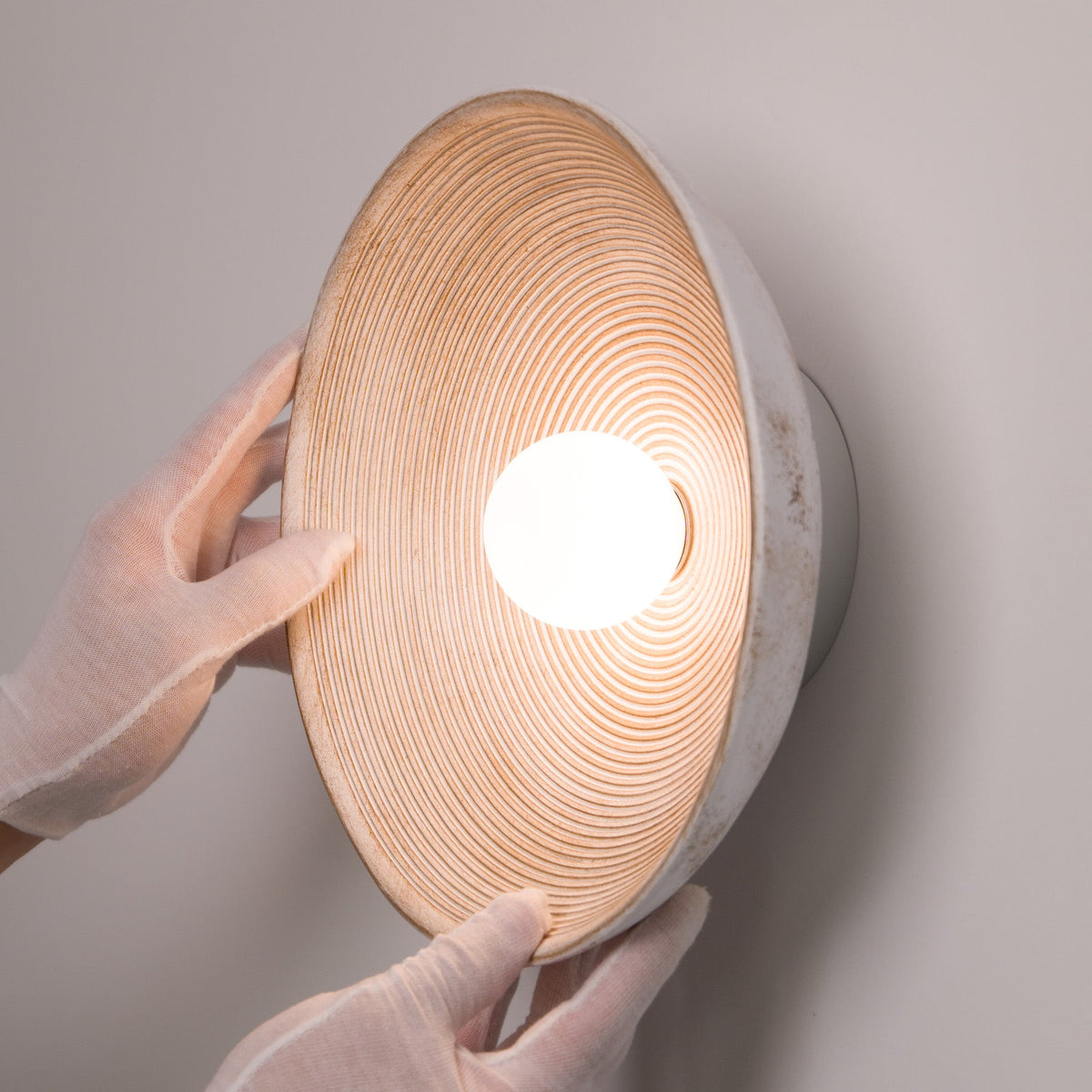 Longleaf Wooden Texture Plate Wall Light In White, finish and hardware close up