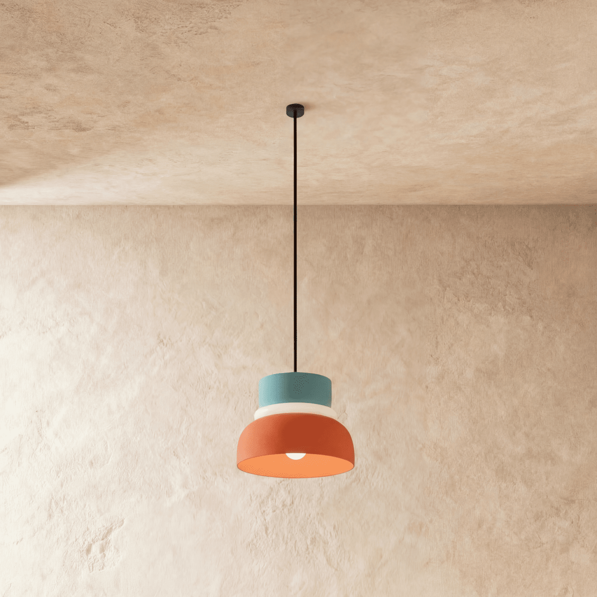 Macaron Metal Pendant Light, third lit and hanging in a styled room