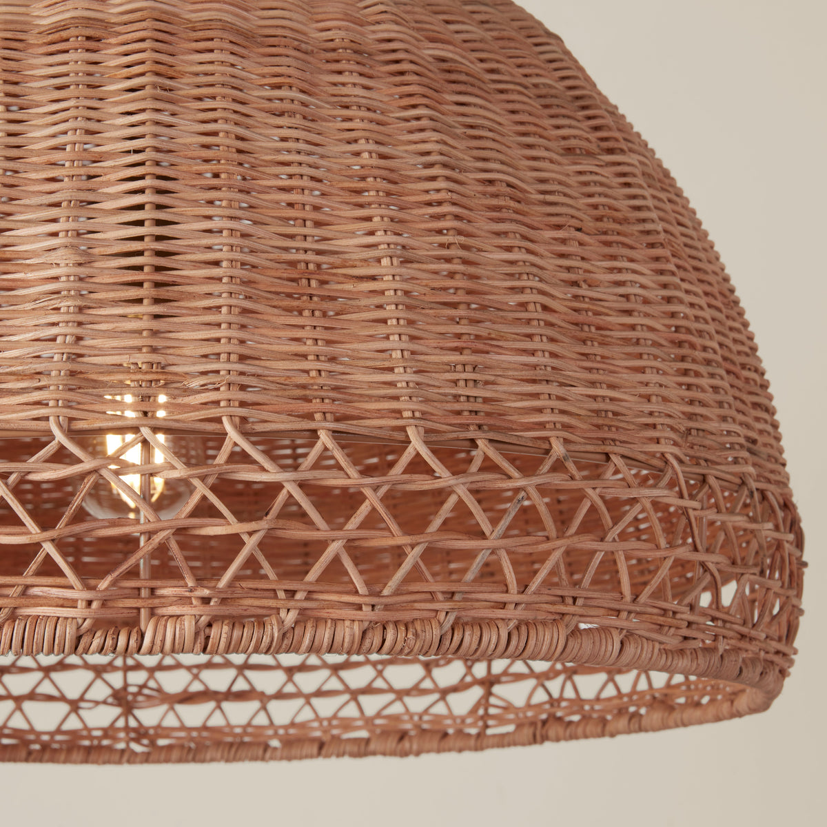 Marea Wicker Pendant Light, warm glow when lit