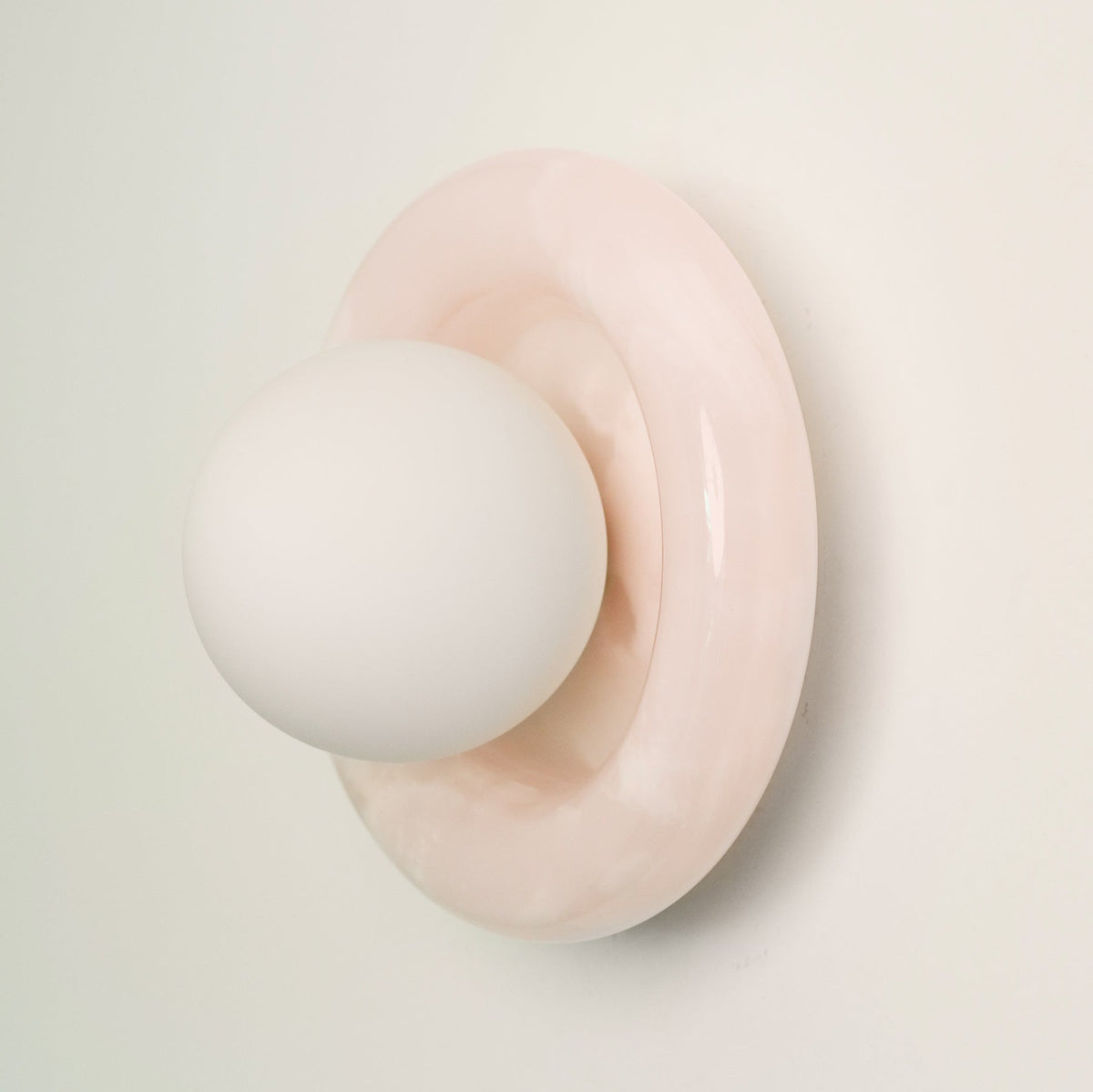 Nara Alabaster Cloud Stone Bubble Plate Wall Light, mounted on the wall