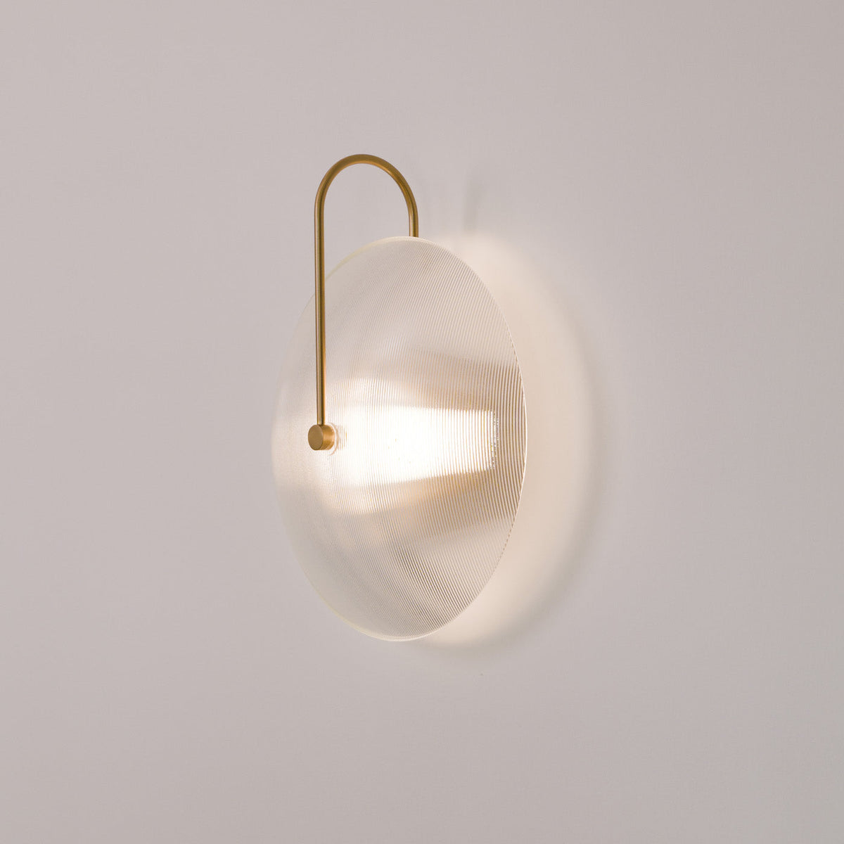 Orbit Mid Century Art Deco Wall Light, fixture lit in a room
