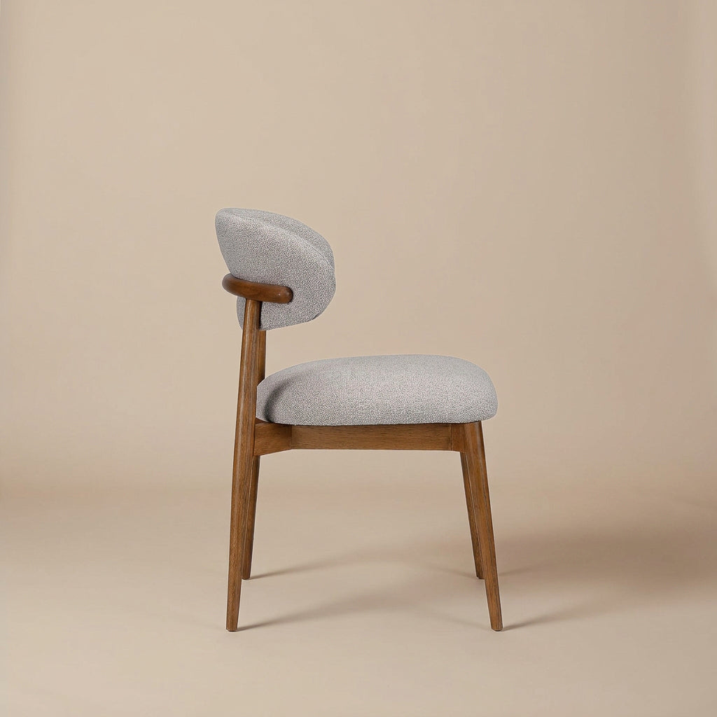 Romy Dining Chair, scale beside a table