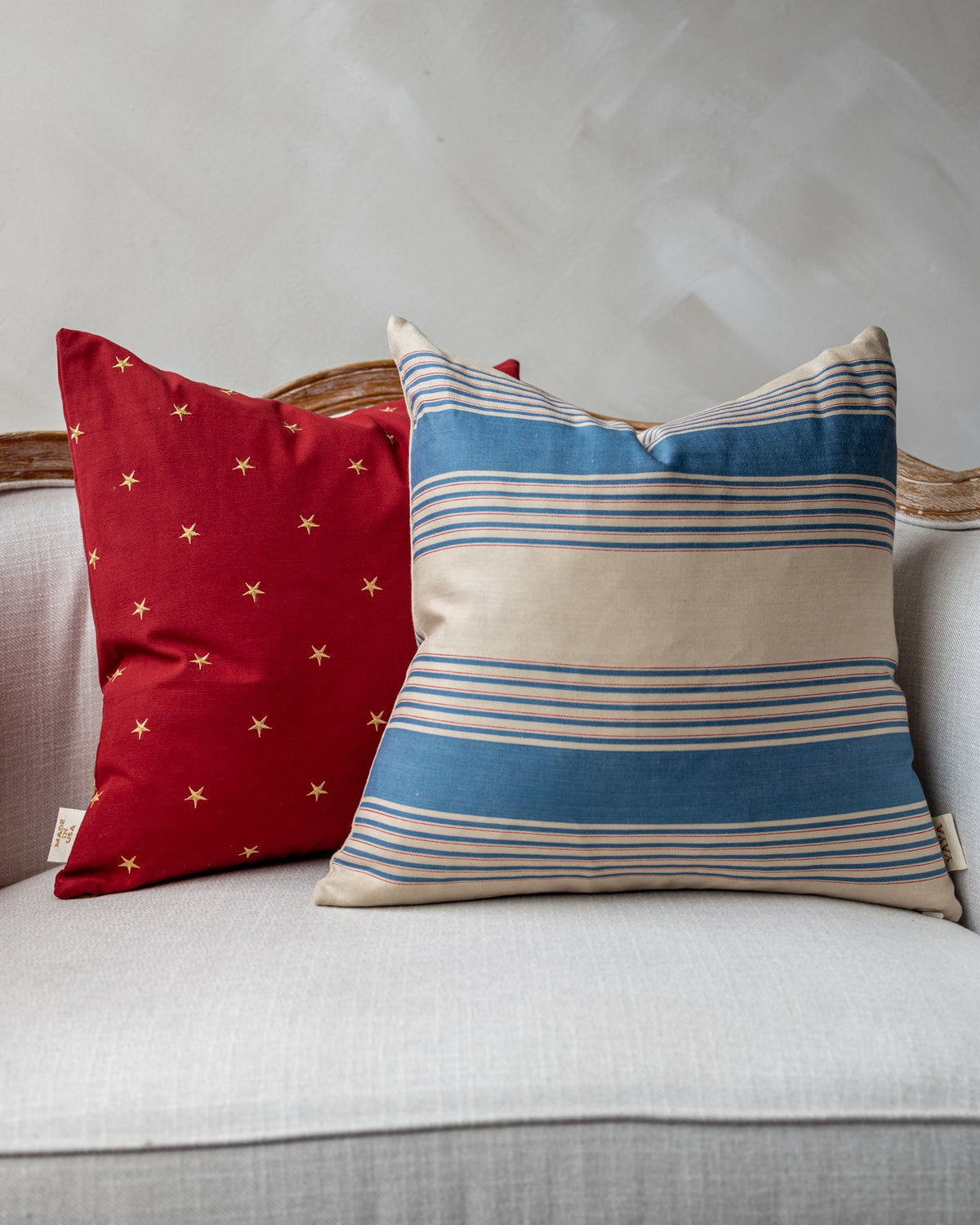Sadie Embroidered Star Throw Pillow, styled on a sofa