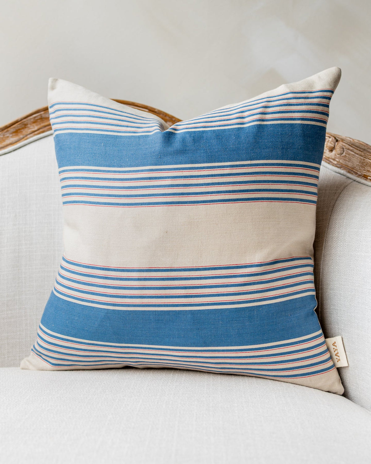 Samuel Striped Throw Pillow, draped and styled view