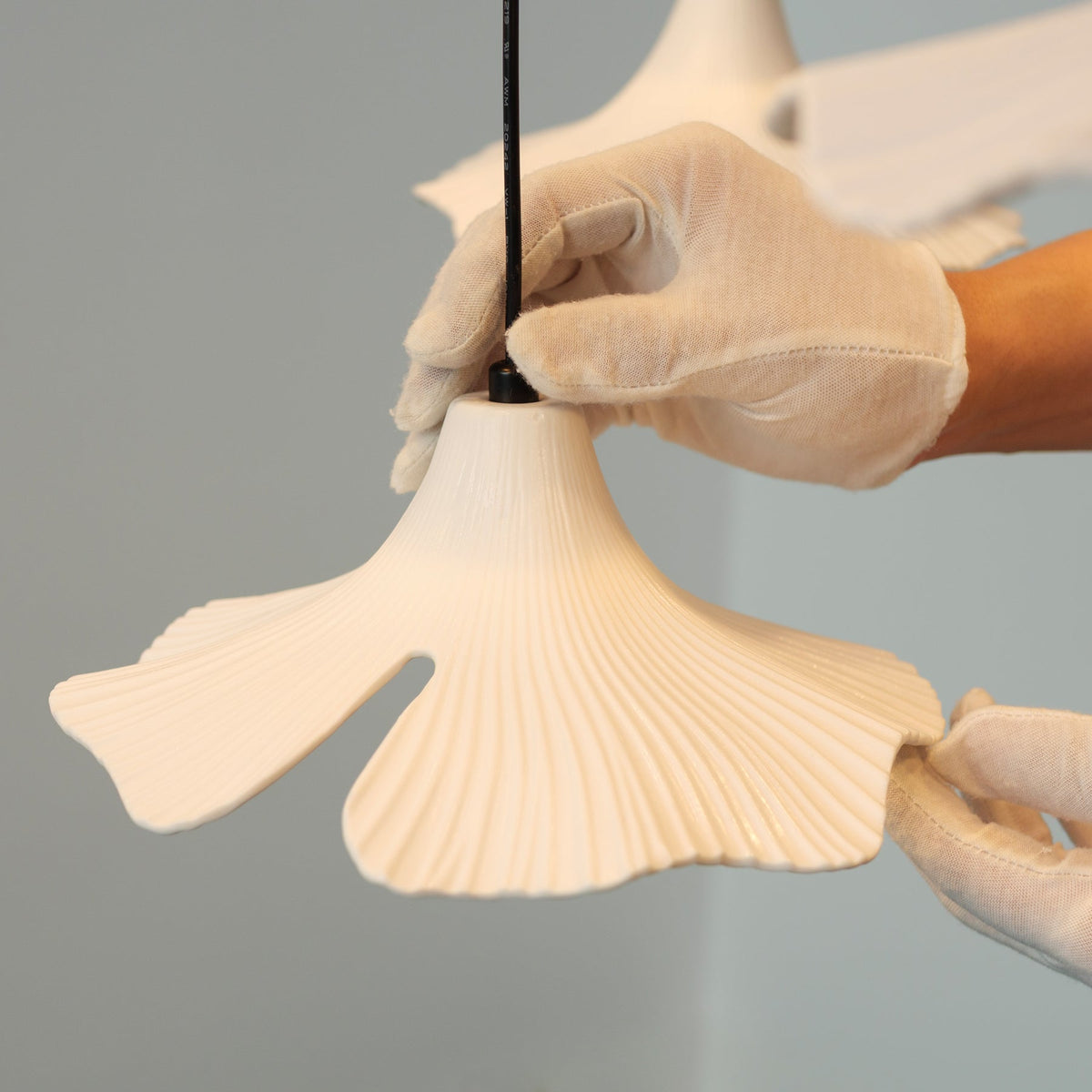 Sculptural Porcelain Ginkgo Leaf Wabi-sabi Pendant Light, styled above a table