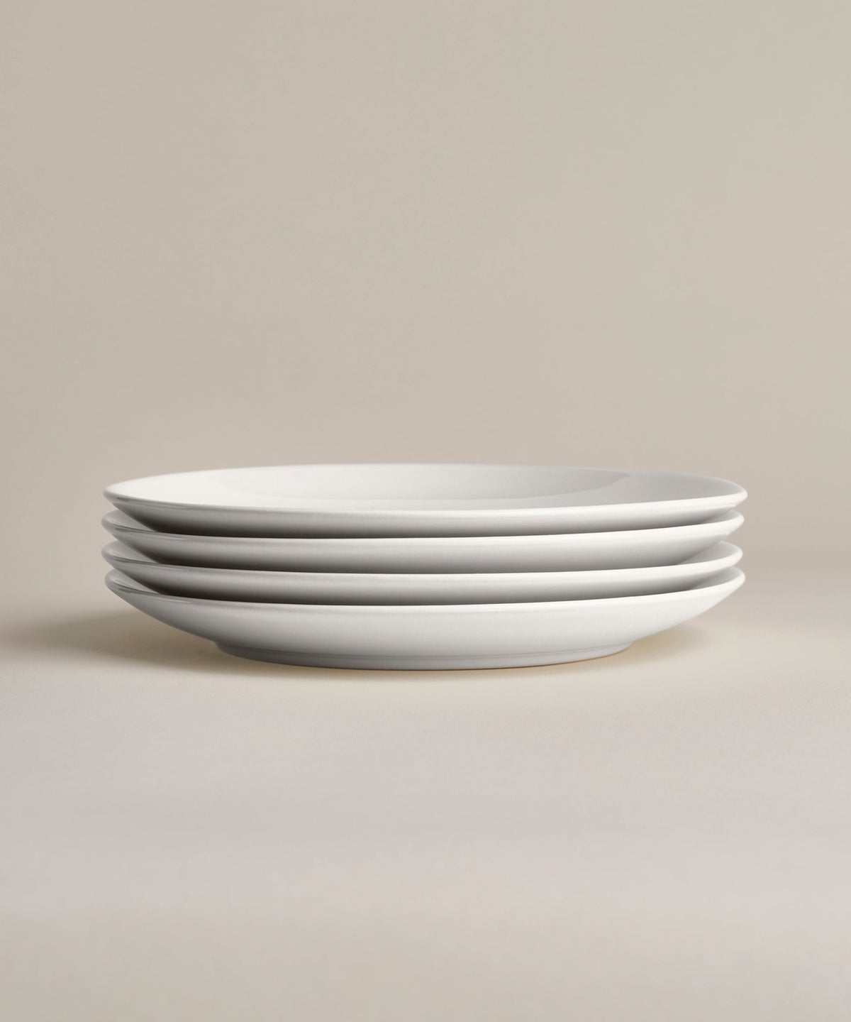 Stoneware Glossy Small Plate Set, Moon, held in hand for scale