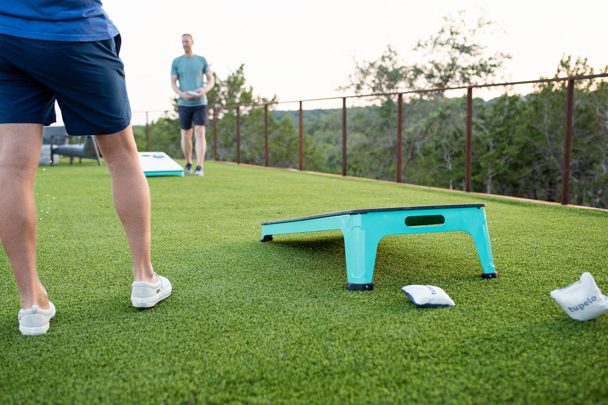 All-Weather Cornhole Set, seafoam, styled in a real room