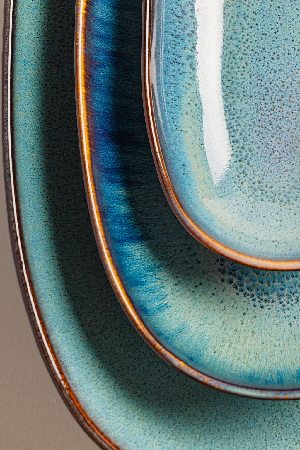 Ceramic Serving Platter Trio, coastline, held in hand for scale