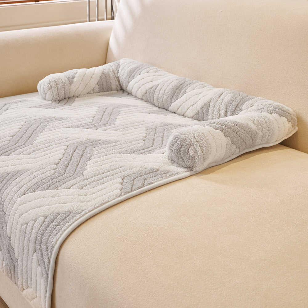Chevron Plush Bolster Pet Sofa Bed, styled in a living room
