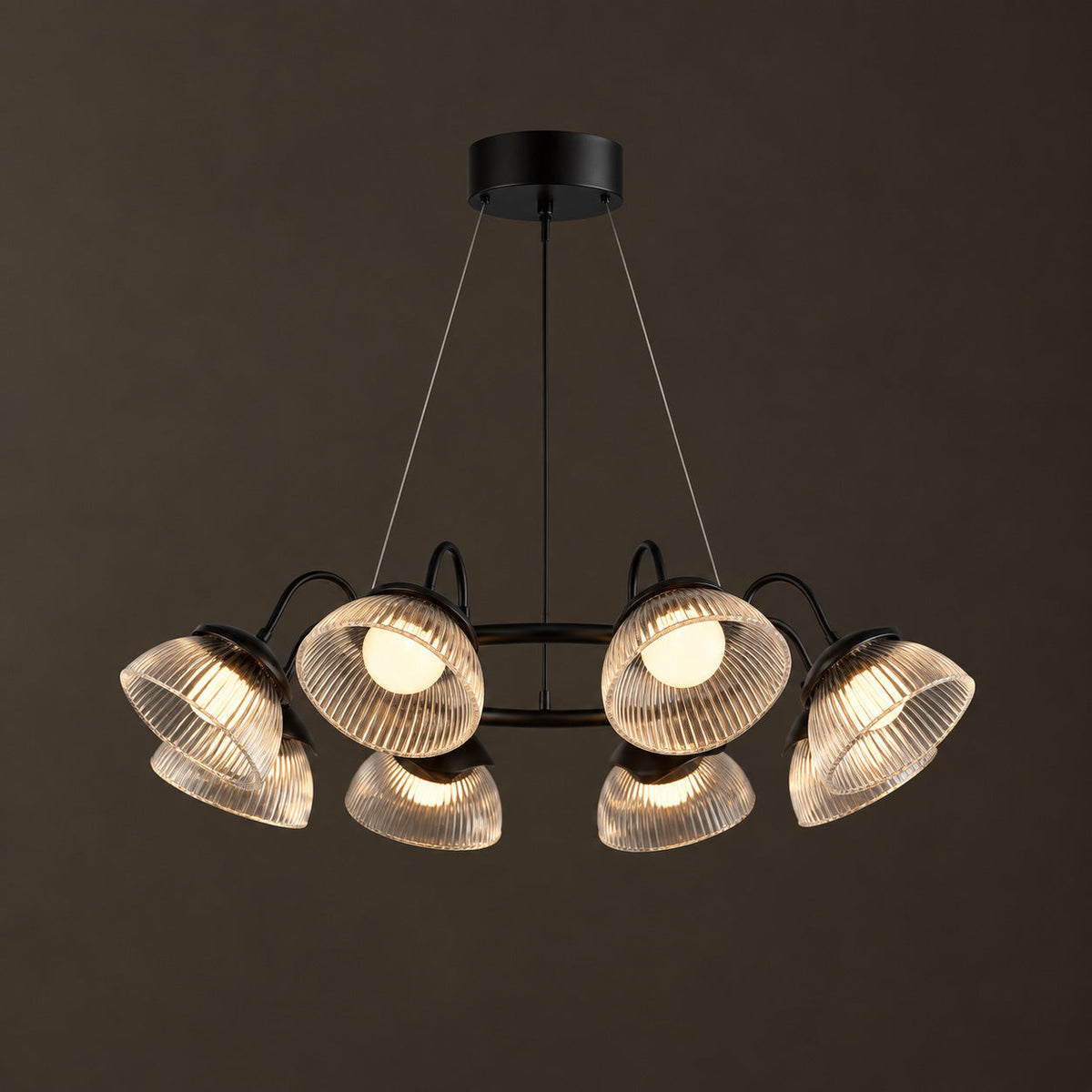 Coronis Fluted Glass LED Chandelier, second view above a table