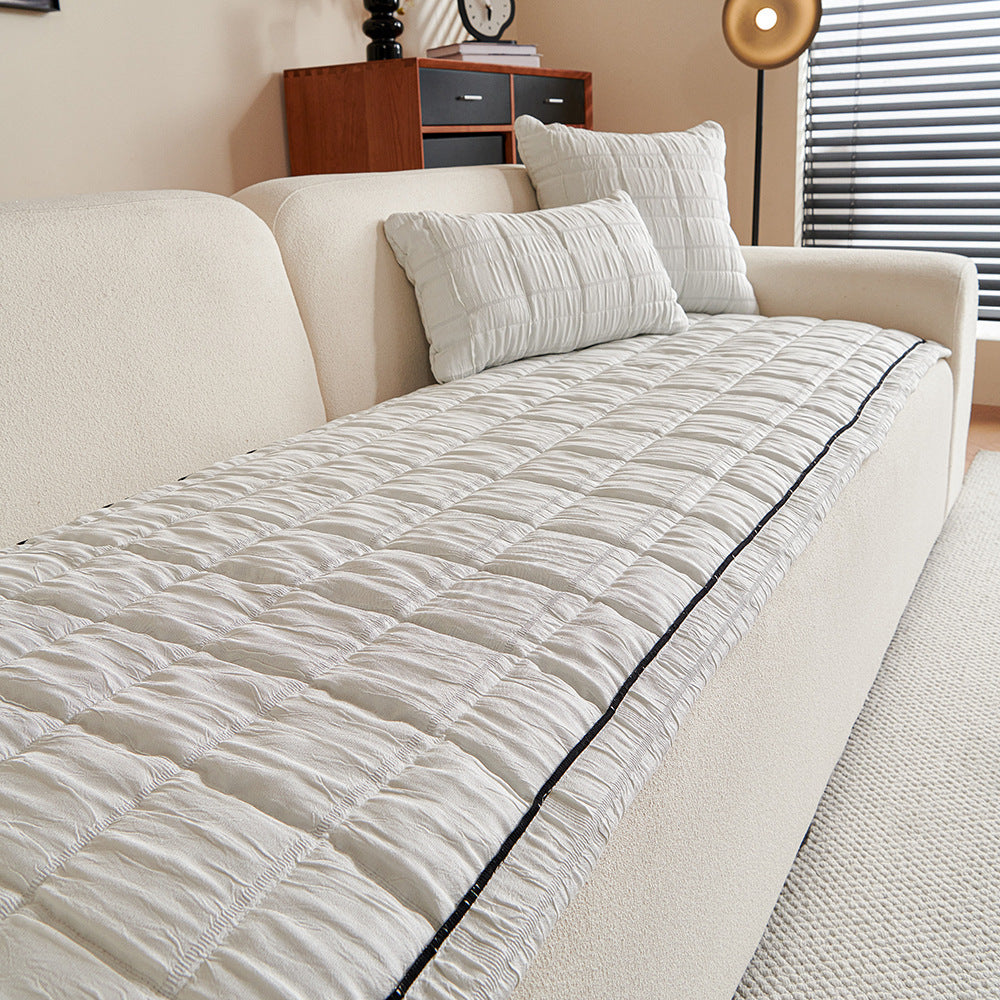 Crinkle Texture Non-Slip Sofa Mat, draped and styled view