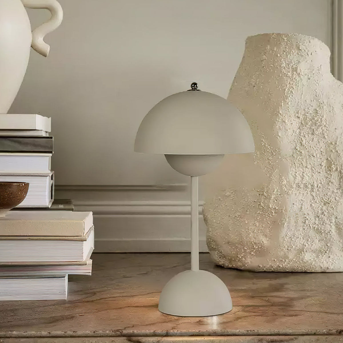 Duo Dome Portable Table Lamp, lit in a styled room