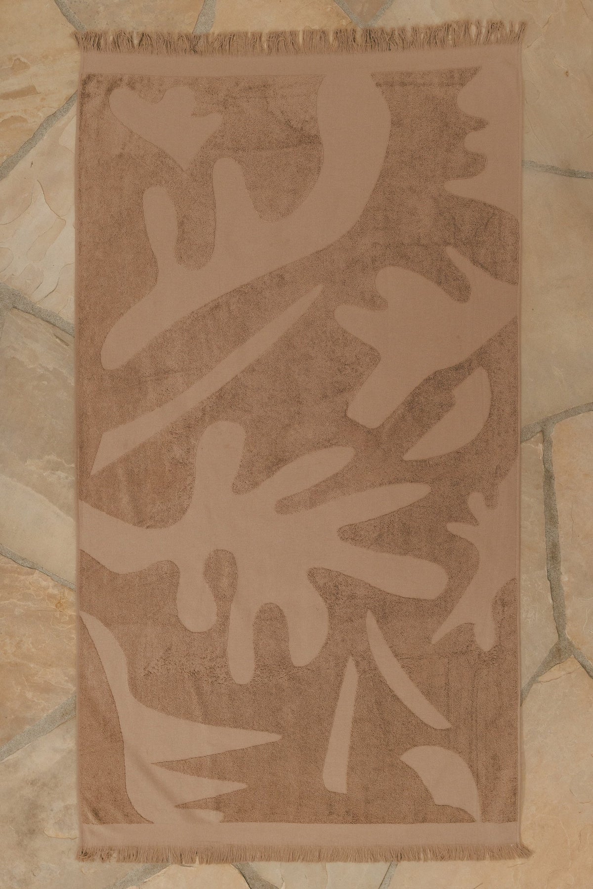 Espresso Woven Beach Towel, styled in a living space