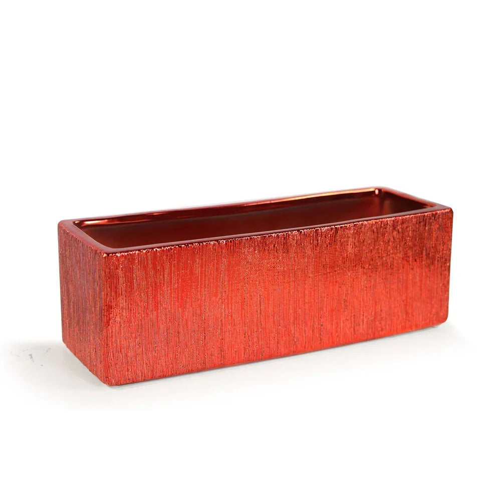 Etched Metallic Red Collection, styled with greenery