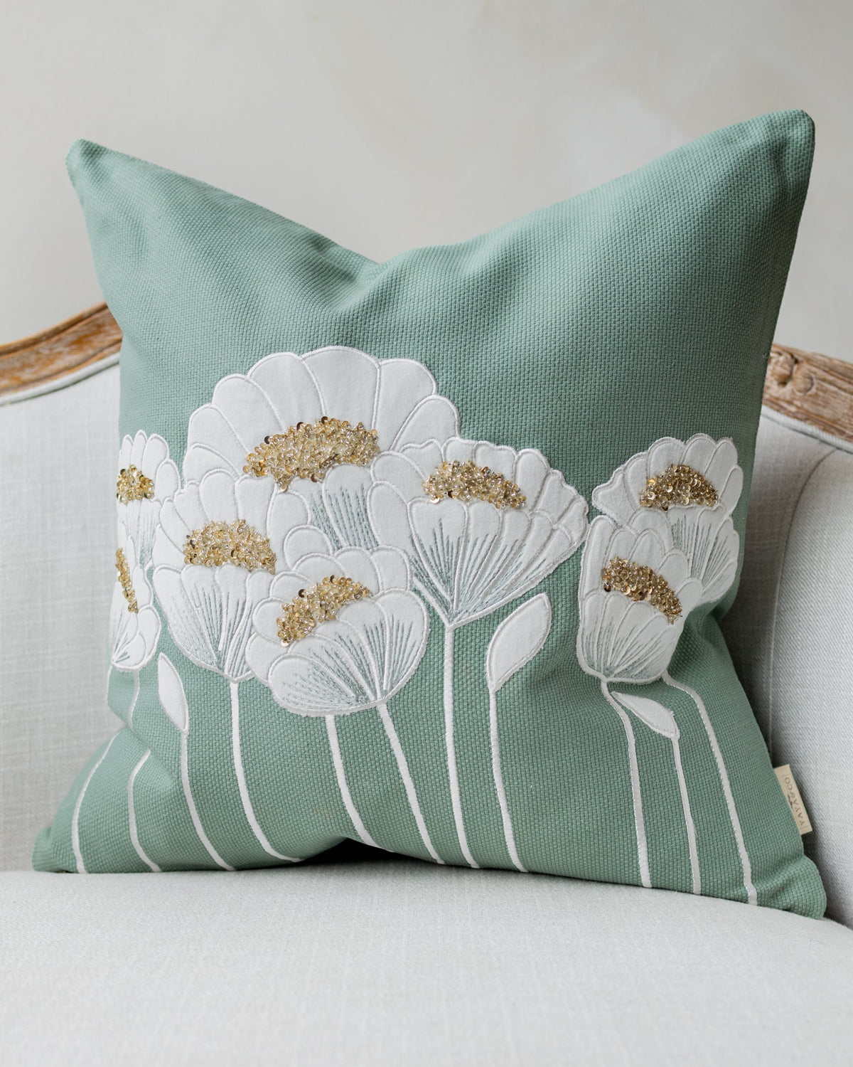 Fleur Organic Cotton Beaded Throw Pillow, draped and styled view