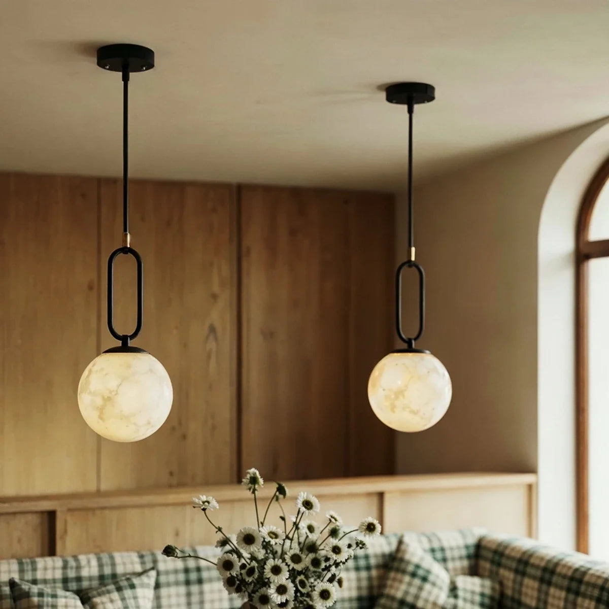 Gong Alabaster Pendant Light, styled above a dining table