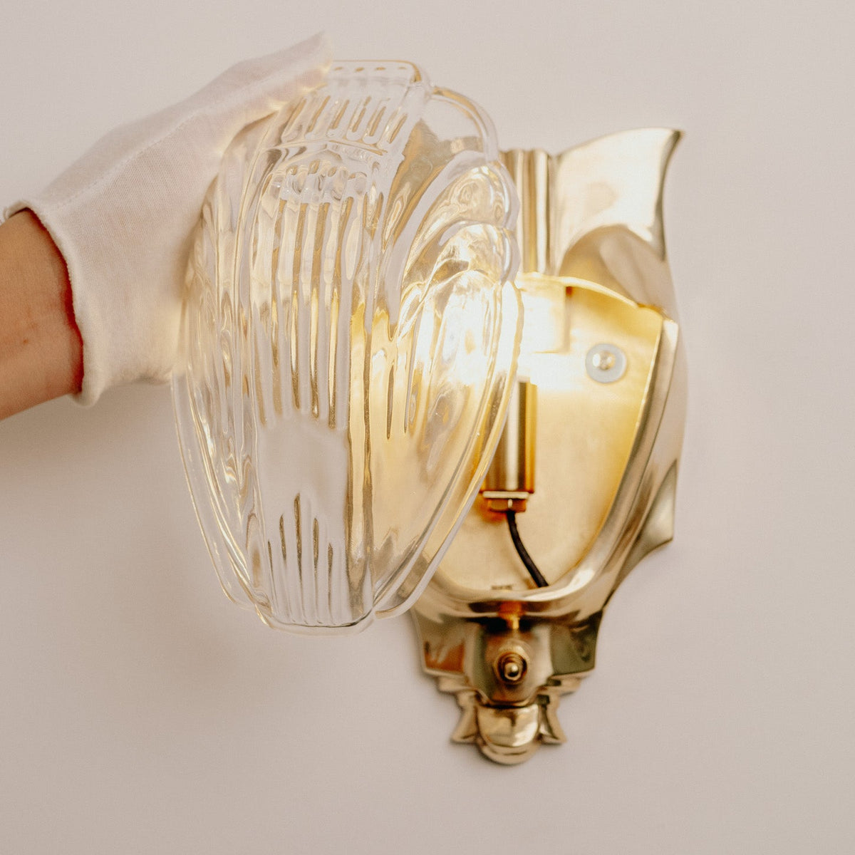 Lilith Brass Antique Art Deco Wall Light, mounted on the wall