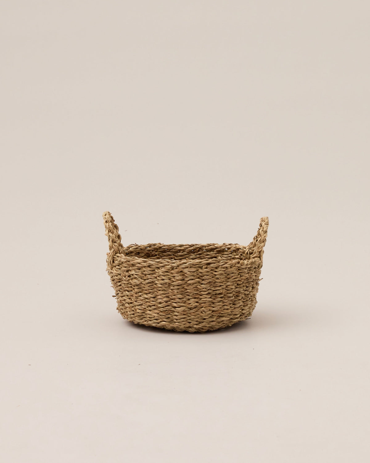 Little Dume Woven Basket, styled on a surface
