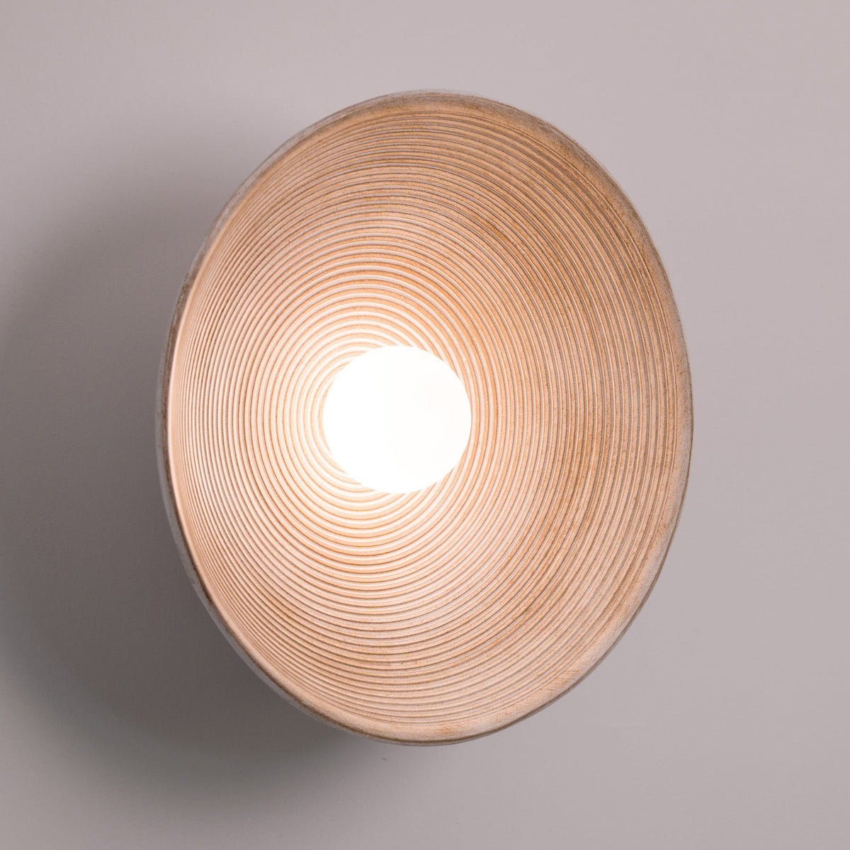 Longleaf Wooden Texture Plate Wall Light In White, lit after dark