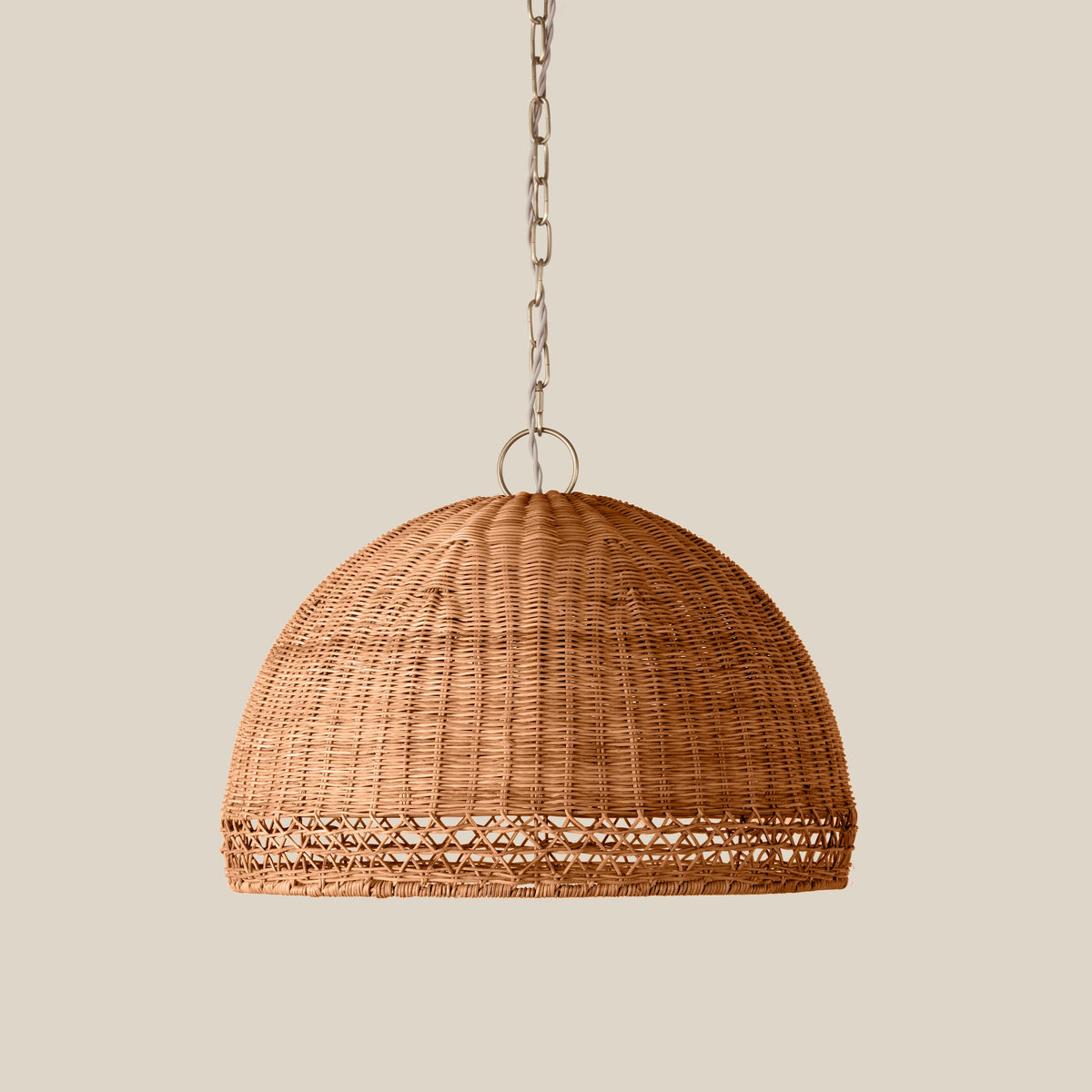 Marea Wicker Pendant Light, lit in a styled room