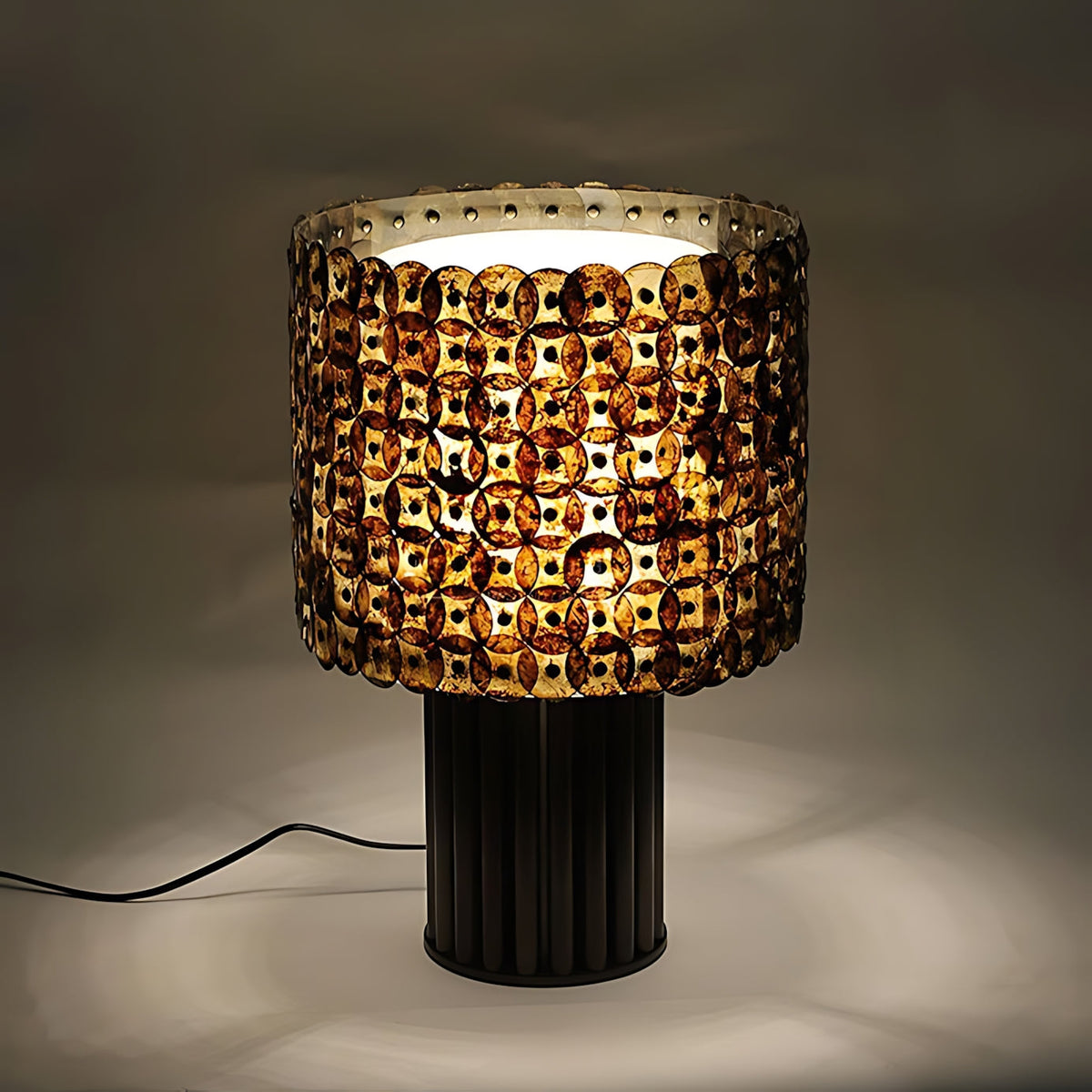 Naerix Shell Table Lamp, third lit on a side table