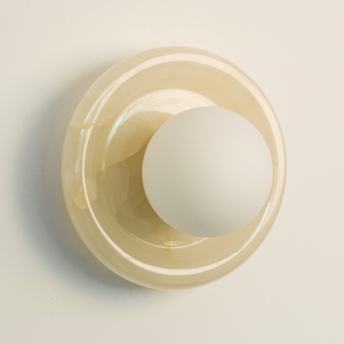 Nara Alabaster Cloud Stone Bubble Plate Wall Light, scale beside a doorway