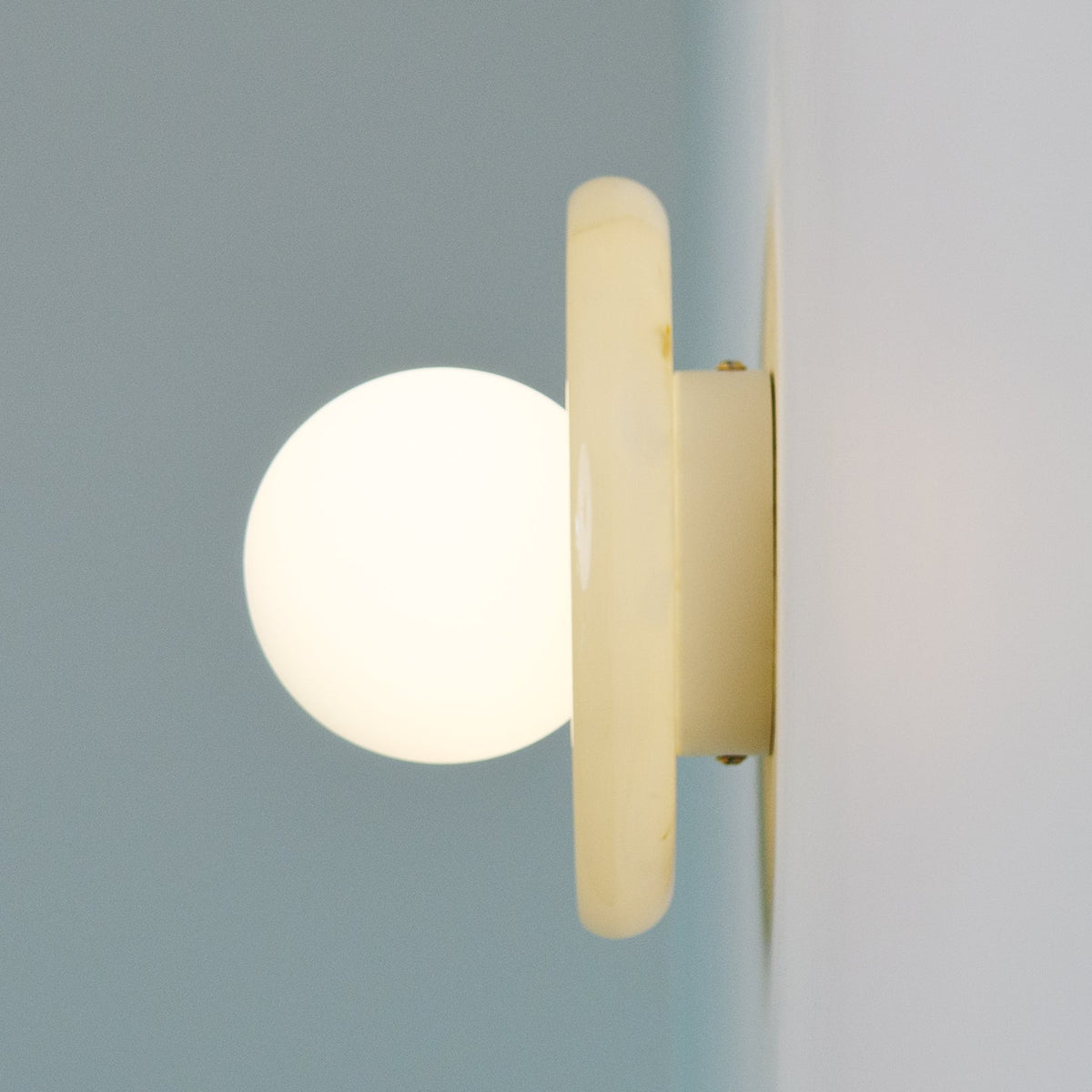 Nara Alabaster Cloud Stone Bubble Plate Wall Light, fixture lit in a room (2)