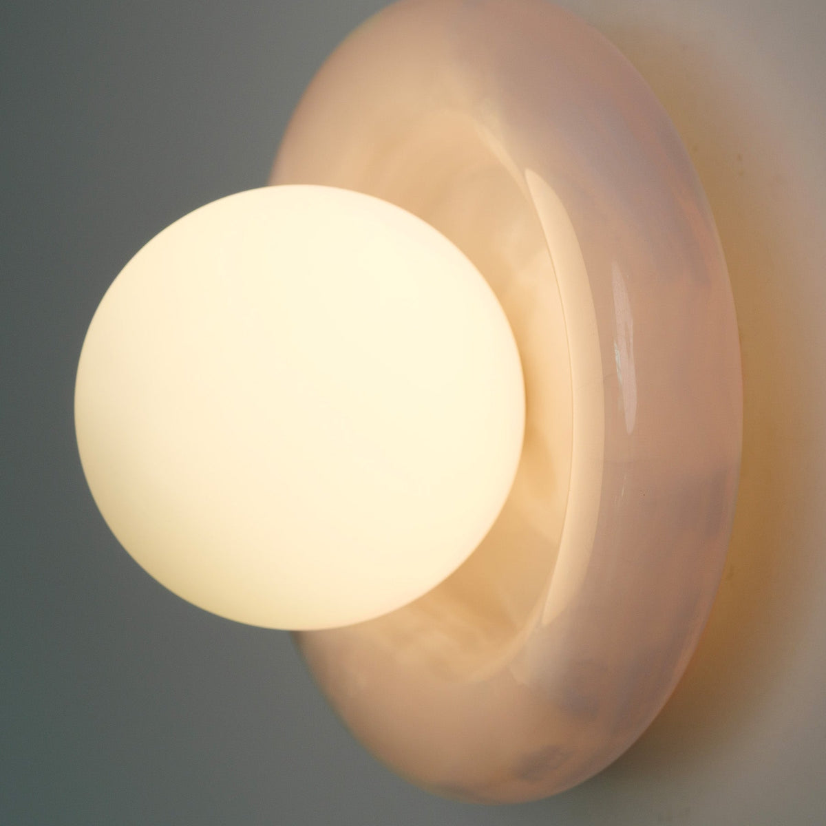 Nara Alabaster Cloud Stone Bubble Plate Wall Light, lit after dark