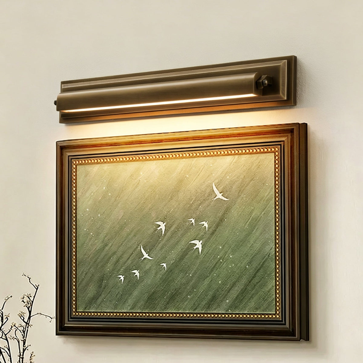 Roswell Linear Brass Wall Sconce, lit in a styled room