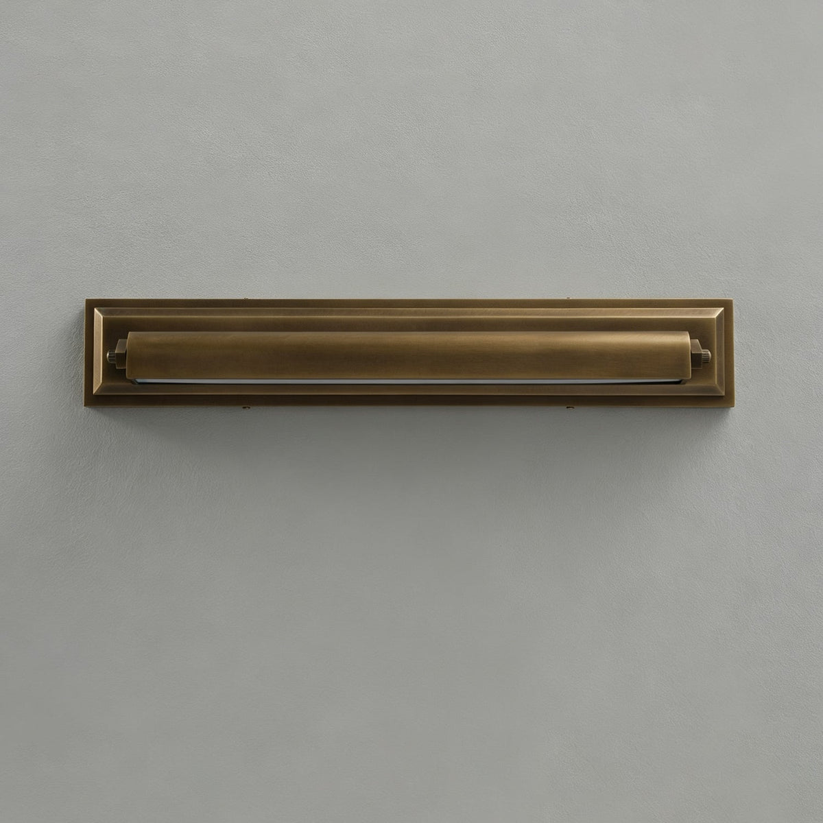 Roswell Linear Brass Wall Sconce, held for scale