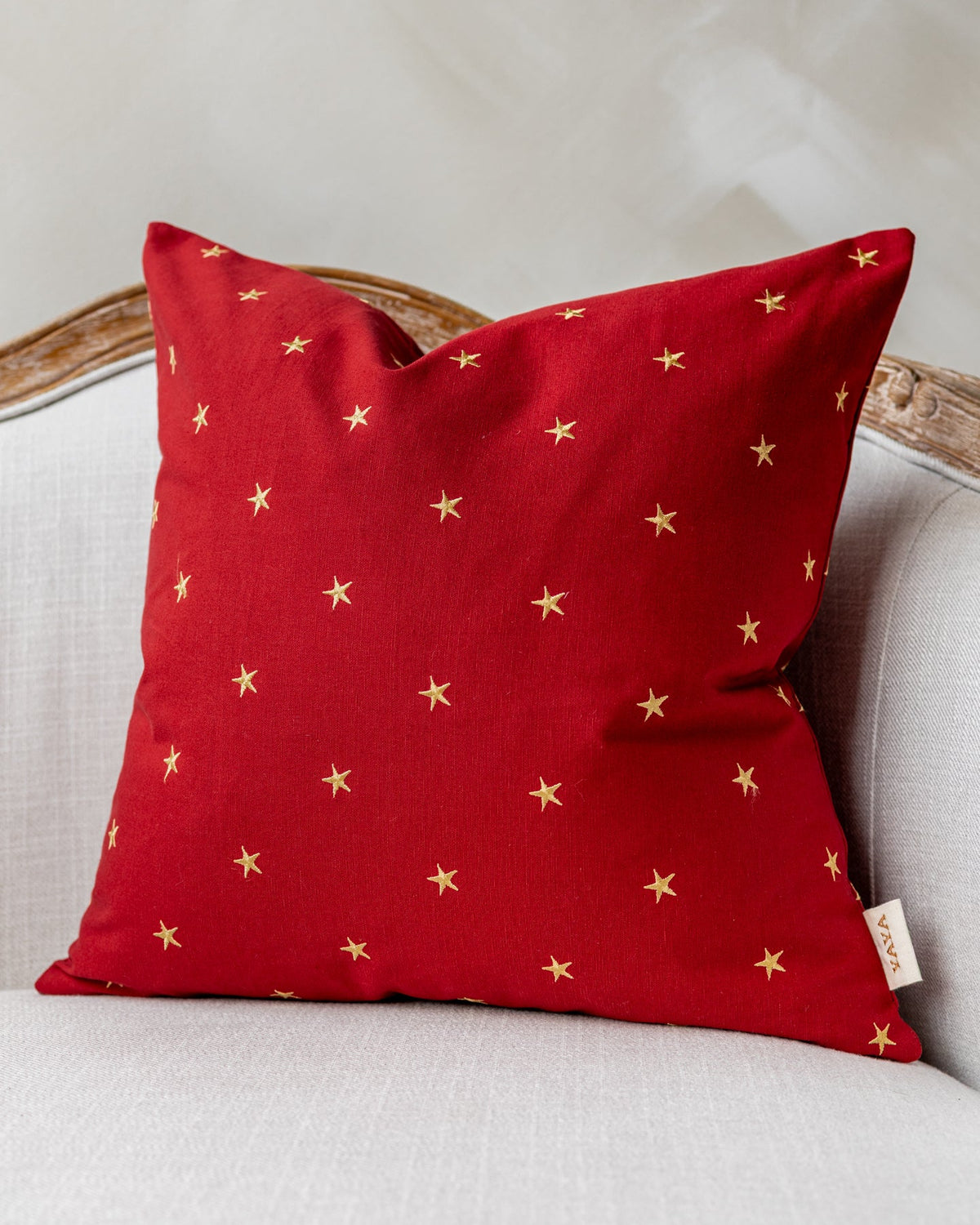 Sadie Embroidered Star Throw Pillow, draped and styled view
