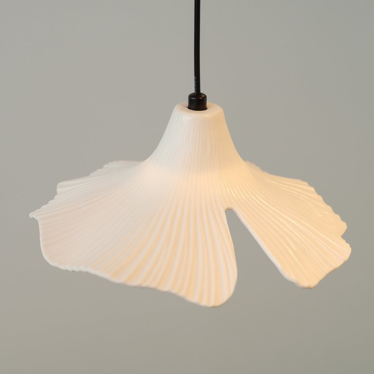 Sculptural Porcelain Ginkgo Leaf Wabi-sabi Pendant Light, fixture lit in a room