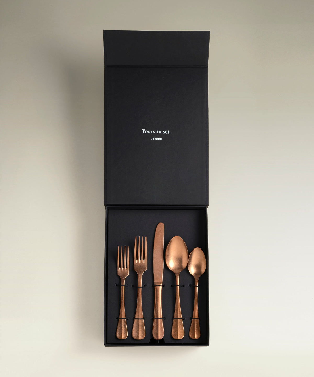 Sea Cliff Four-Person Flatware Set, copper, single piece on a plain surface