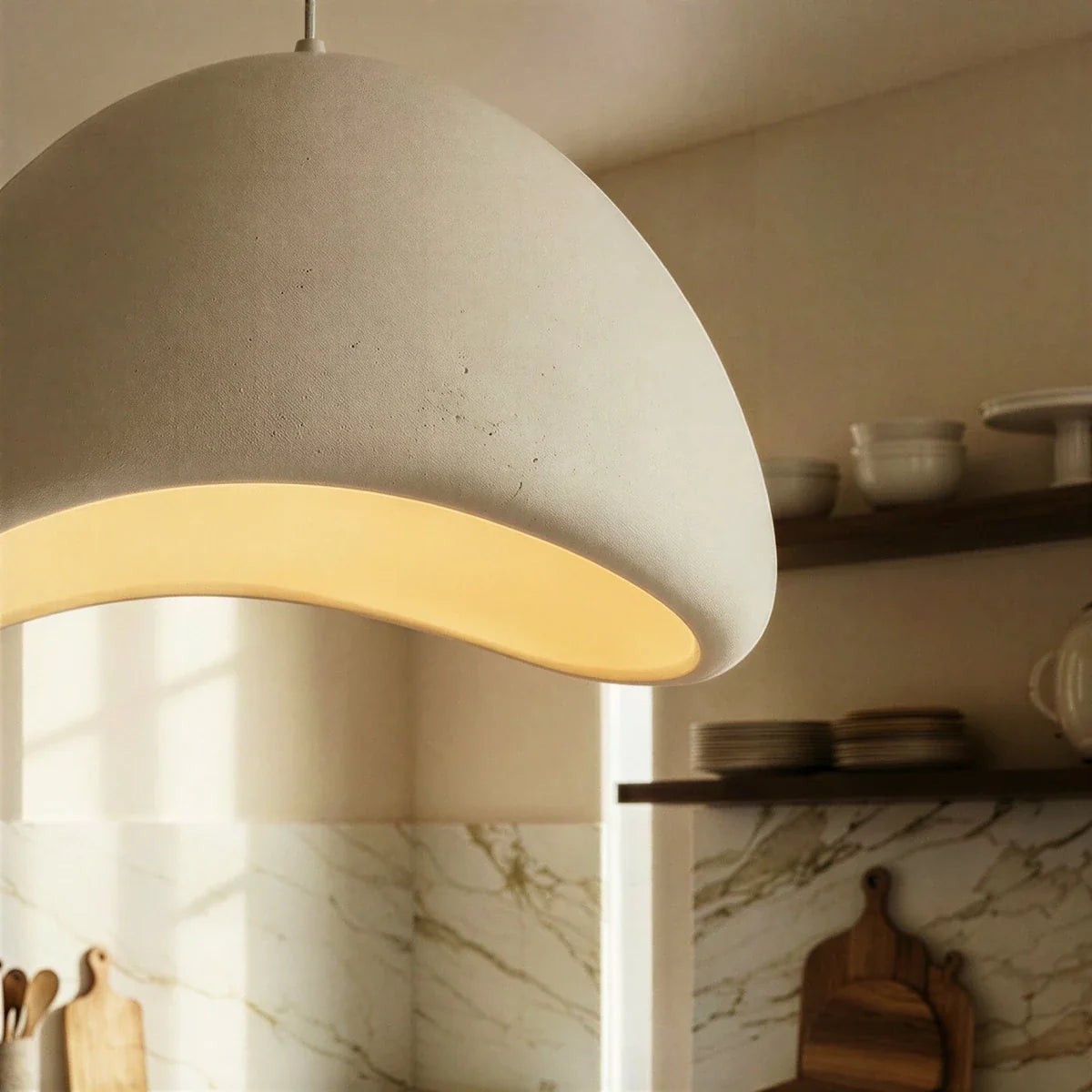 Shibui Metal Pendant Light, third lit and hanging in a styled room