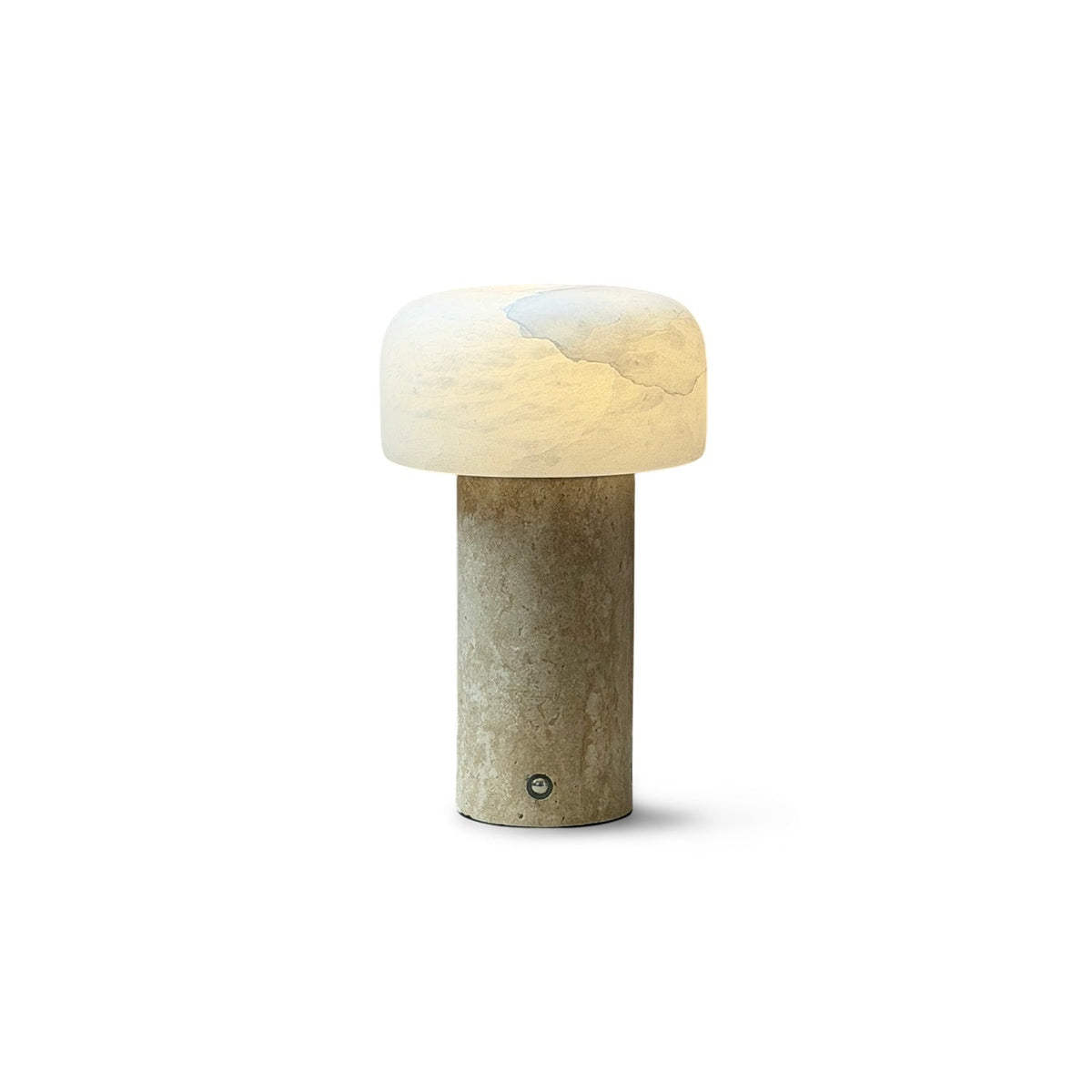 Sorvane Travertine Alabaster Table Lamp, lit on a side table