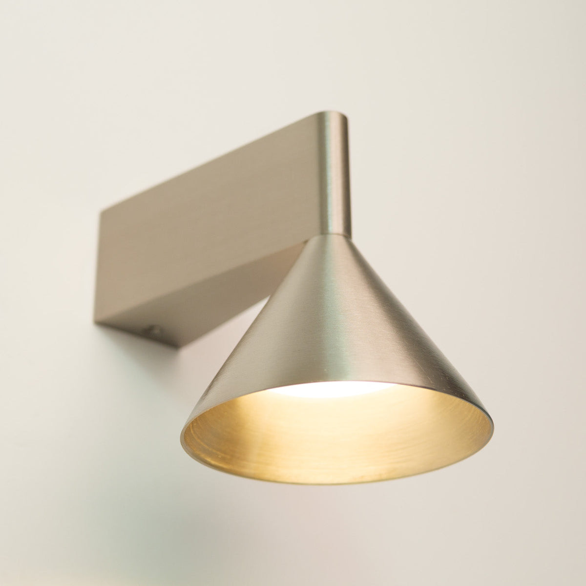 Staccato Modern Minimalist Wall Light, fixture lit in a room