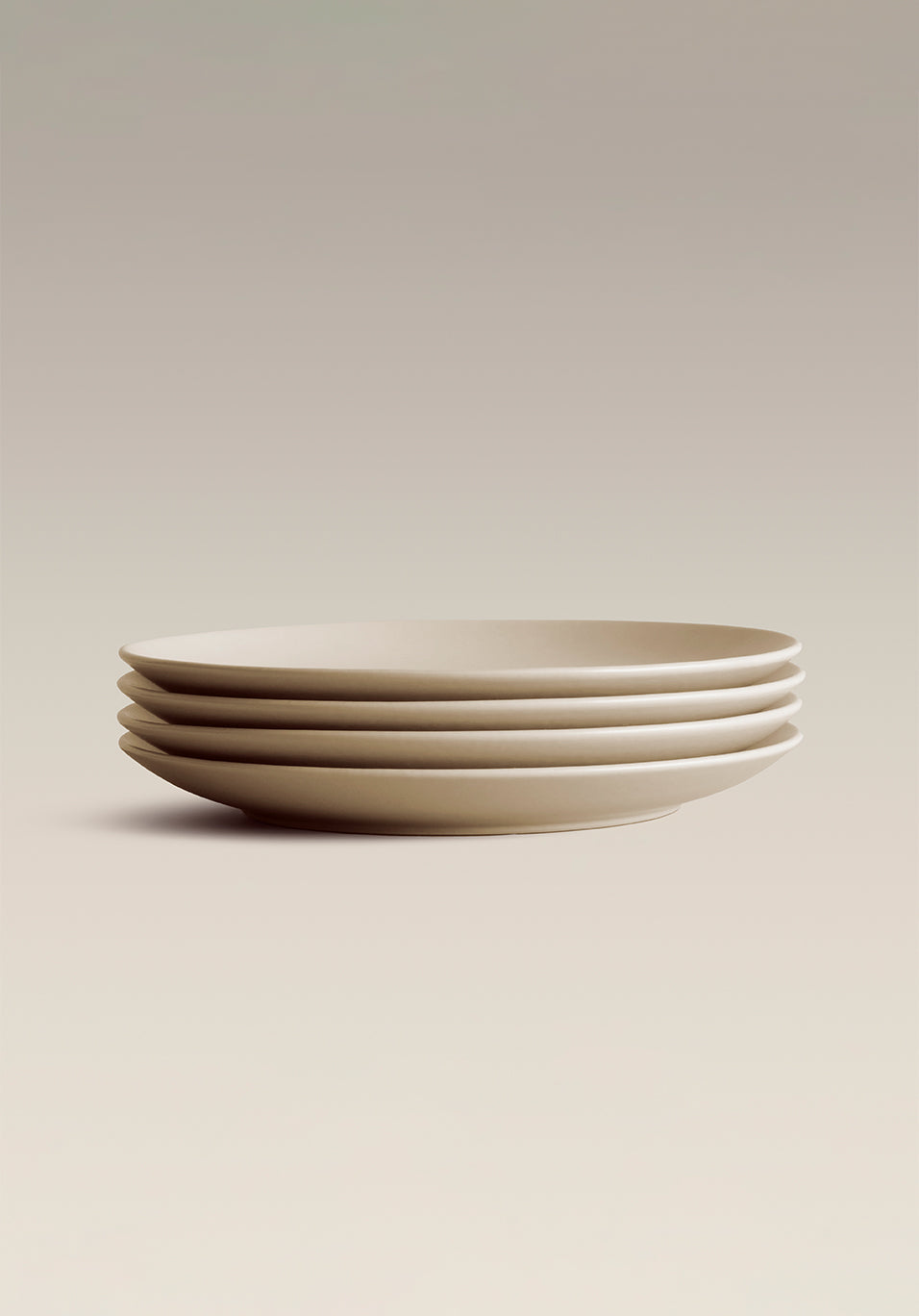 Stoneware Small Plate Set, held in hand for scale